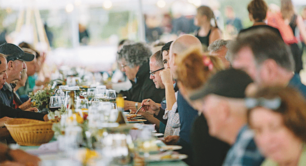 Sustain Supper 2016 diners outside at a long table