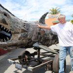 Image for display with article titled Capitola Artist Crafts Colossal Shark Sculpture