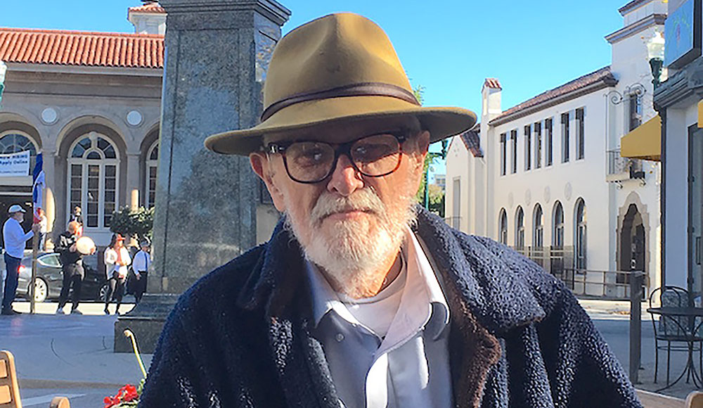 Photo of a man outside wearing a hat