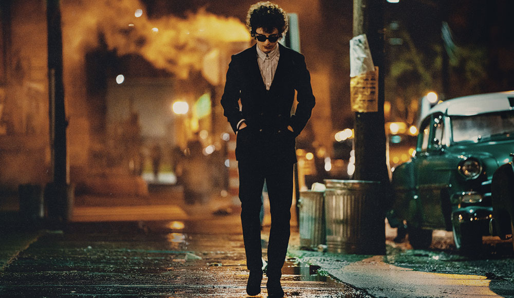 Man walking on a city street at night