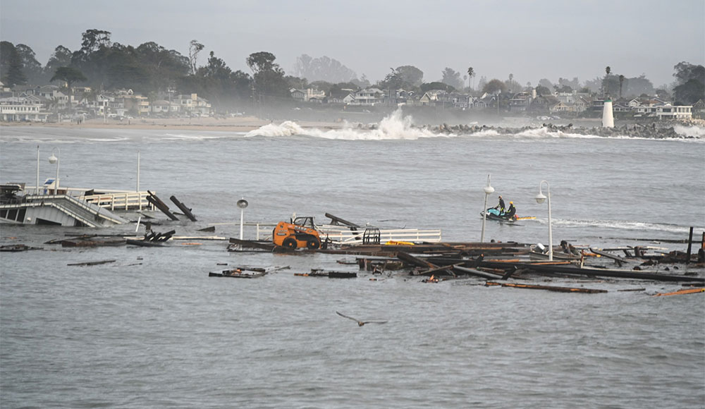 Debris from wharf battered by heavy surf